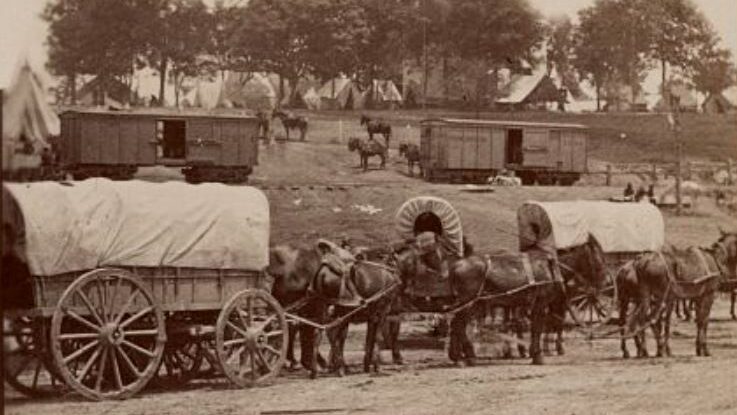 McClellan - Army of the Potomac headquarters with railroad cars in the background, and covered wagons in the foreground